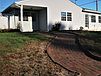 A house with a lawn and a brick path