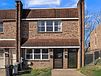 A brick house with a driveway