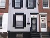 A building with stairs leading to the front door