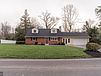 A house with a lawn in front of it

Description automatically generated